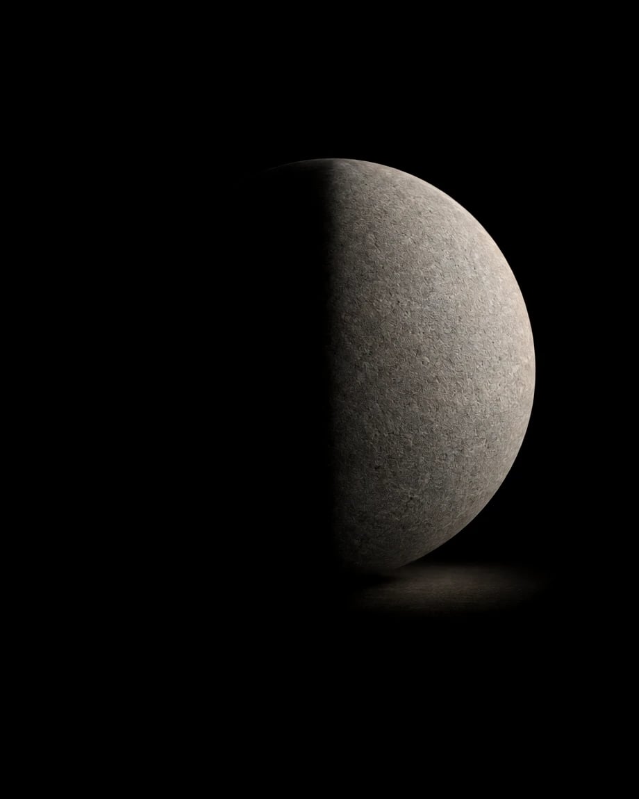 The same sphere with only its right half in light.